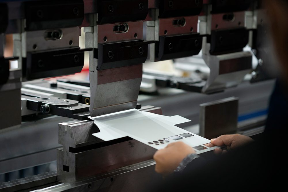 operator bending metal sheet by sheet bending machine