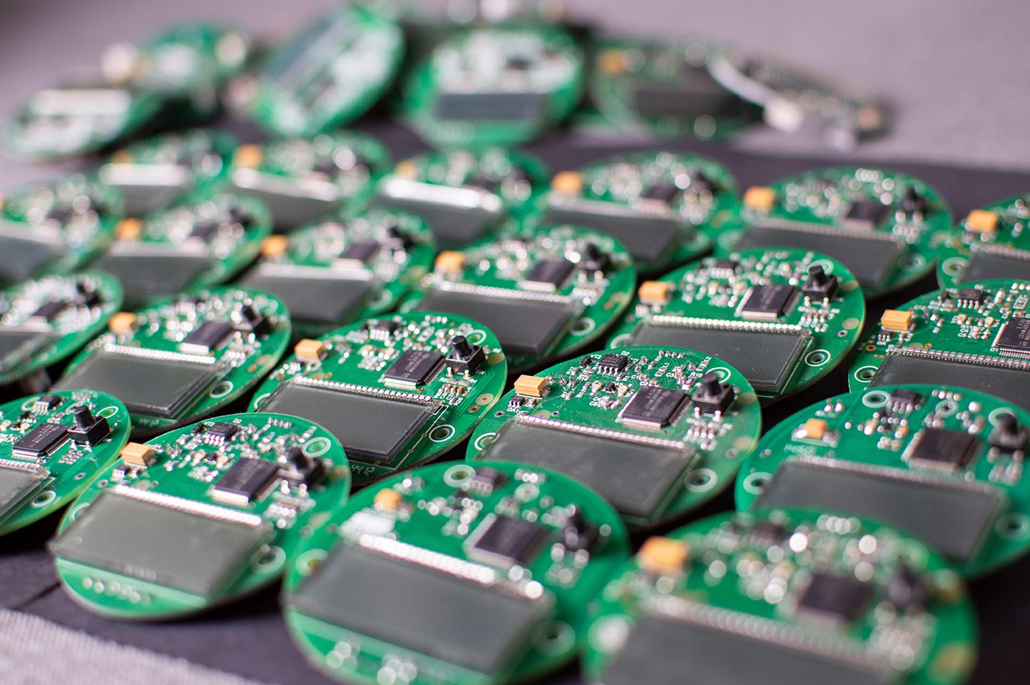round electronic boards with display, microchip and processor, many meter components